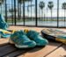 Close-up of padel shoes on synthetic court next to racket