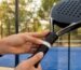Hand measuring padel racket grip size outdoors