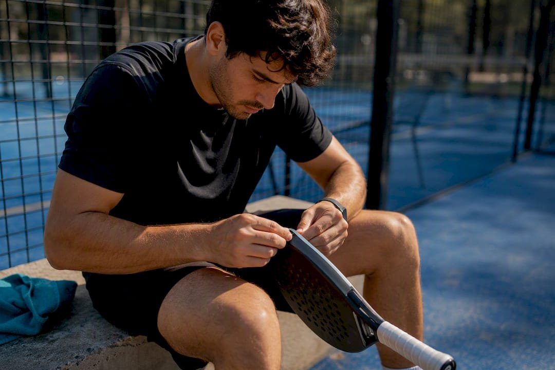 Padel player swinging racket during testing