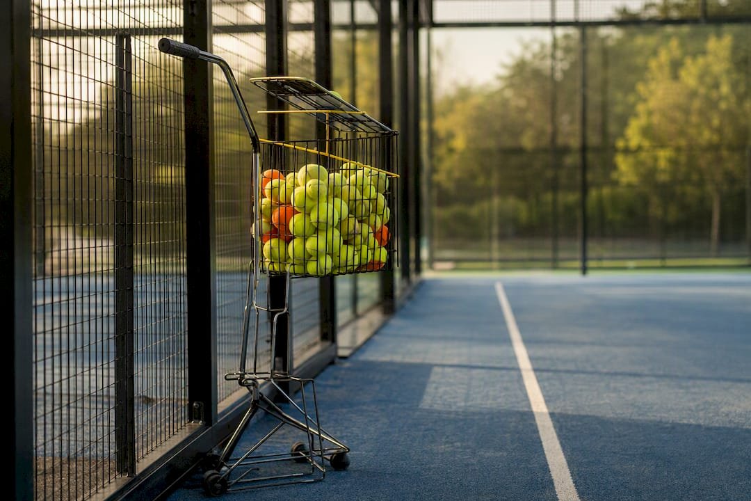Padel ball basket collector on court